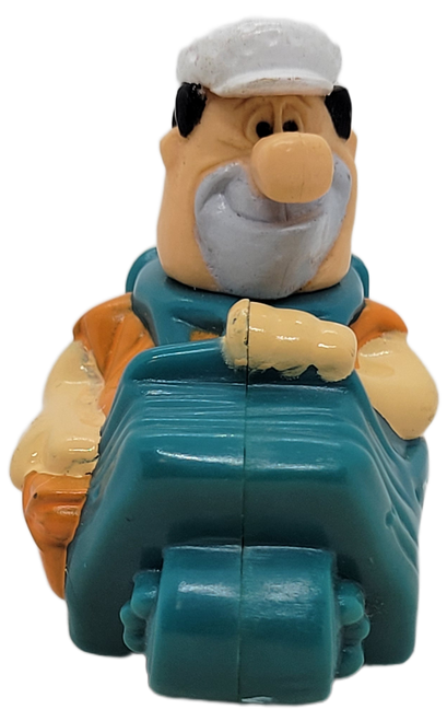 Taco Bell Kids' Meal Fred Flintstone in golf cart for age under 3 toy from the 1995 Flintstones Stone Age Stampers series. The under age 3 toy is the same as the regular without the stamper and just rolls. The series contains 4 regular stampers and 1 Under 3 toy.