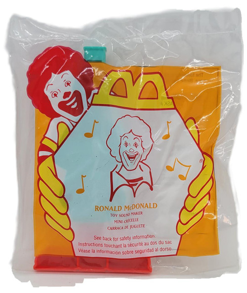 McDonald's Happy Meal Toy 1996 Toy Sound Maker Ronald McDonald, illustrated packaging with Ronald McDonald and an elderly woman, musical notes, and colorful design.