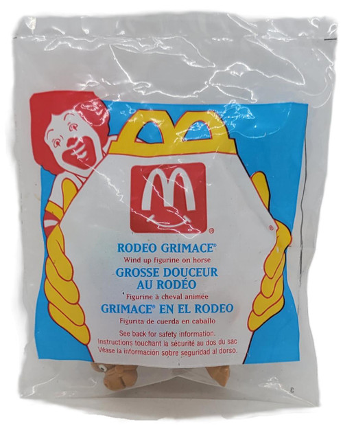 McDonald's Happy Meal Toy 1995 McRodeo Rodeo Grimace, wind-up figurine on horse in original packaging.