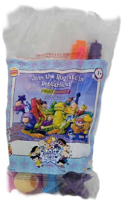 Burger King Kids' Club Daktar's Descent with Lil from the 2000 Rugrats in Paris: The Movie series of toys. Lil is riding a pink car on a blue track that descends down a purple poll. The series contained 8 different ride from Reptarland to recreate a working Reptarland from the Rugrats in Paris: The Movie.