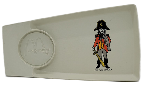 McDonald's Captain Crook Happy Meal serving tray from the 1970's era.  The tray would hold you food and drink and is 11-inches long and 6-inches wide at widest part. The tray is designed to place your drink and your food together. Captain Crook (later "The Captain") was a pirate character in McDonaldland commercials from 1971 to the mid-1980s, known for trying to steal Filet-O-Fish sandwiches, appearing similar to Disney's Captain Hook.