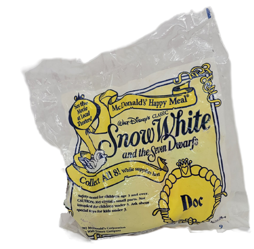 McDonald's Happy Meal toy of Doc from the 1993 Walt Disney's Snow White and the Seven Dwarfs series of toys. Doc is pushing a wheelbarrow with diamonds in it. The series contained 8 different characters and was available July 9 -August 5, 1993.