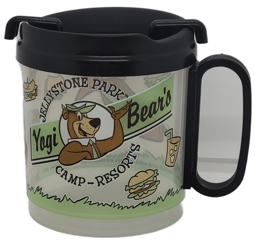 Yogi Bear's Jellystone Park Camp-Resorts travel mug by Whirley Industries. The travel mug holds hot or cold beverages. Yogi Bear's Jellystone Park Camp-Resorts is a chain of more than 75 family friendly campgrounds throughout the United States and Canada. The clear mug stands 3.5-inches tall and is 3-inches wide without the handle.