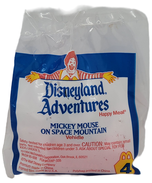 McDonald's Happy Meal toy of Mickey Mouse on Space Mountain vehicle from the 1995 Disneyland Adventures series of toys. Mickey Mouse is riding in a Space Mountain car that has wheels on the bottom. The series contains 8 different Disney characters from Disneyland rides with picture inside that was available June 1 - 30, 1995.