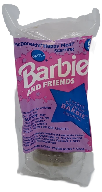 McDonald's Happy Meal toy of Locket Surprise Barbie from the 1994 Barbie and Friends and World of Hot Wheels series of toys. Locket Surprise Barbie is wearing a pink dress and pink shoes. The series contains 8 different Barbie and Friends figures and 8 different World of Hot Wheels toys and was available August 5 - September 8, 1994.