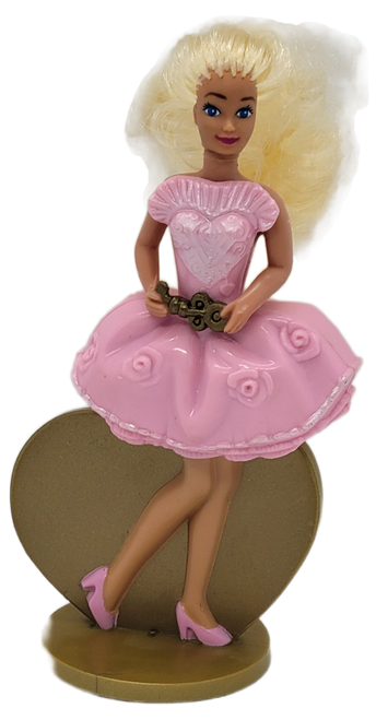 McDonald's Happy Meal toy of Locket Surprise Barbie from the 1994 Barbie and Friends and World of Hot Wheels series of toys. Locket Surprise Barbie is wearing a pink dress and pink shoes. The series contains 8 different Barbie and Friends figures and 8 different World of Hot Wheels toys and was available August 5 - September 8, 1994.