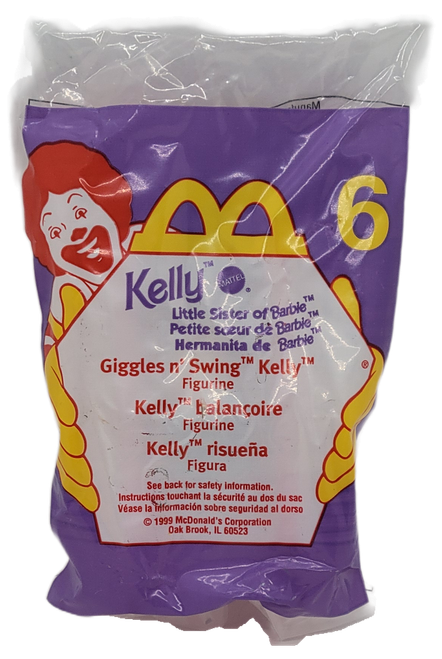 McDonald's Happy Meal toy of Giggles n' Swing Kelly figurine from the 1999 Barbie/Hot Wheels series of toys. Kelly is wearing a red outfit with blue shirt while riding a swing. The series contains 8 different Barbie characters and 8 different Hot Wheels and was available August 13 - September 9, 1999.