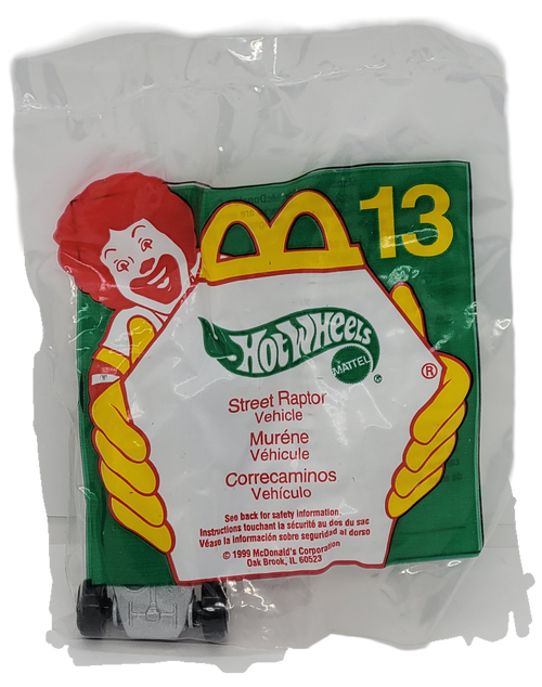 McDonald's Happy Meal toy of Street Raptor vehicle from the 1999 Barbie/Hot Wheels series of toys. The Street Raptor is purple with silver window. The series contains 8 different Barbie characters and 8 different Hot Wheels and was available August 13 - September 9, 1999.