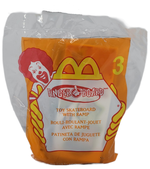 McDonald's Happy Meal toy of a toy skateboard with ramp from the 2000 Finger Board series of toys. The purple plastic skateboard ramp is 5-inches long. The series contains 8 different skateboard themed toys.
