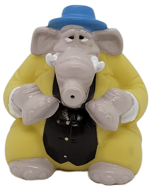 Subway Kids' Pak Woolie squirter from the 1997 Mammuth Pictures Cats Don't Dance distributed by Warner Bros. series of toys. The Woolie squirter is an elephant wearing a yellow suit with black vest and was available for kids under 3 toy. The series of toys contained 4 regular toys and 1 for ages above 1.