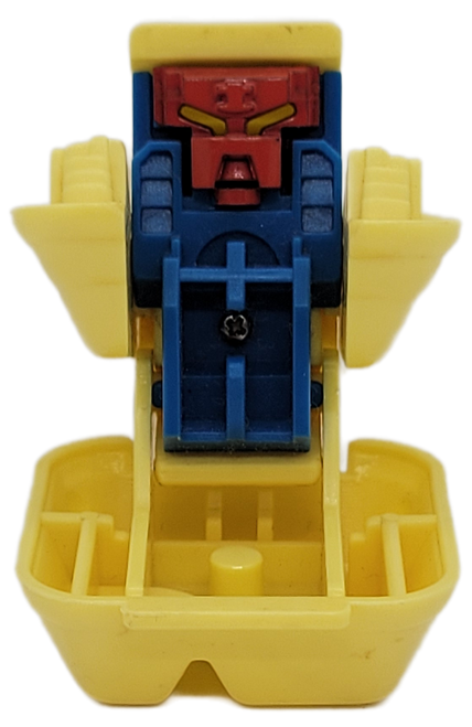 McDonald's Happy Meal Toy of Chicken McNuggets from the 1987 McDonald's Changeables series of toys. The yellow Chicken McNuggets box opens up and reveals a blue robot with red face. The series contains 6 different McDonald's foods that transform into robots. McDonald's offered the series to appeal to the Transformers popularity.