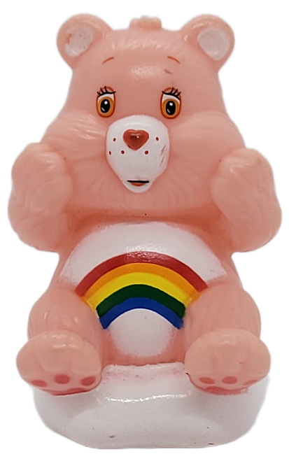 Care Bears 2.5-inch tall plastic figure of Cheer Bear sitting on a cloud.  The figure appears that it may also be a pencil topper.  Cheer Bear is pink with white belly and a rainbow as symbol.