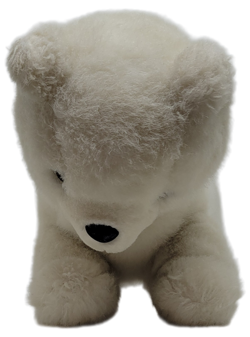 Animal Toys Inc. 1987, 12-inch long plush Polar Bear Made in Korea. The Polar bear is 12-inches long, 6-inches wide and 8-inches tall. The polar bear is made of 100% Polyester Fiber.