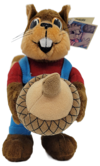 Dakota the squirrel wears blue pants and red shirt and is holding an acorn that is removable.