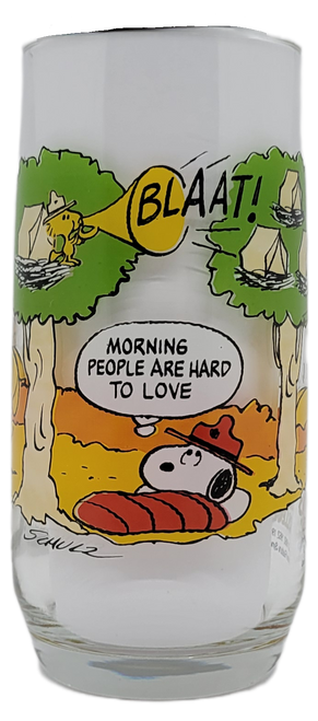 McDonald's Camp Snoopy glass tumbler of Snoopy “Morning People". Back in 1983, the Camp Snoopy theme park was just about to open its doors. To commemorate this event, McDonald’s released a set of promotional drinking glasses in their restaurants featuring the Peanuts Gang camping. Customers would receive a glass with the purchase of a drink. One glass was brought out each week over five weeks. Two kinds were released, glass and plastic versions with the same designs. The designs included Charlie Brown “Hard Work”, Linus “Struggle for Security”, Snoopy “Morning People”, Lucy “Properly Prepared” and Snoopy “Civilization.”