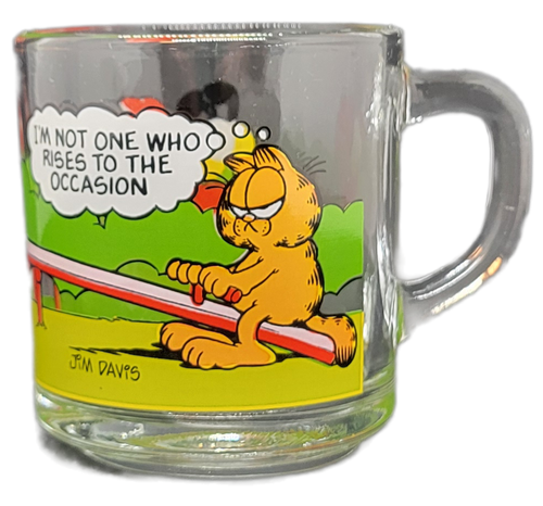 McDonald's 1987 Garfield glass mug "I'm Not One Who Rises to the Occasion" that has Garfield, Odie, Arlene & Pooky on a see-saw.The series of 4 mugs were available to purchase for .69 with any purchase. Garfield is a fictional American cat and the protagonist of the comic strip of the same name, created by Jim Davis. Garfield is portrayed as a lazy, fat, cynical and self-absorbed orange tabby Persian cat.