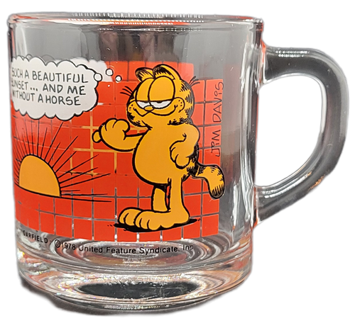 McDonald's 1978 glass coffee cup of Garfield saying "Such a beautiful sunset...and me without a horse" & "I've never seen a sunrise...I'm waiting for the movie" with red checkered background.