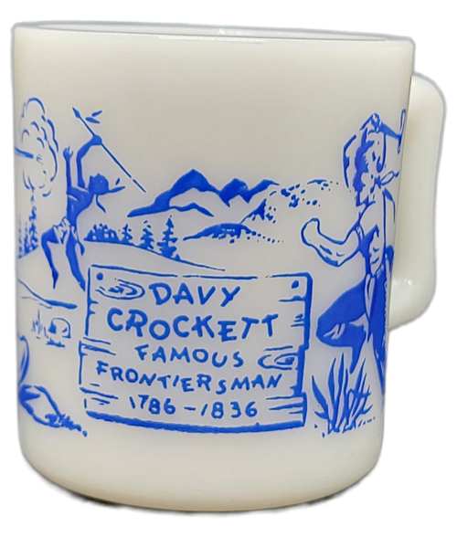 Vintage Hazel-Atlas Davy Crockett Famous Frontiersman 1786-1836 milk glass mug with blue. The mugs were produced sometime in the 1940's or 1950's. The mug is 3-inches tall and 2.75-inches wide without handle and has Davy Crockett firing his rifle with a Native American with a spear in the distance and a Native American with a tomahawk the opposite side of Davy Crockett.