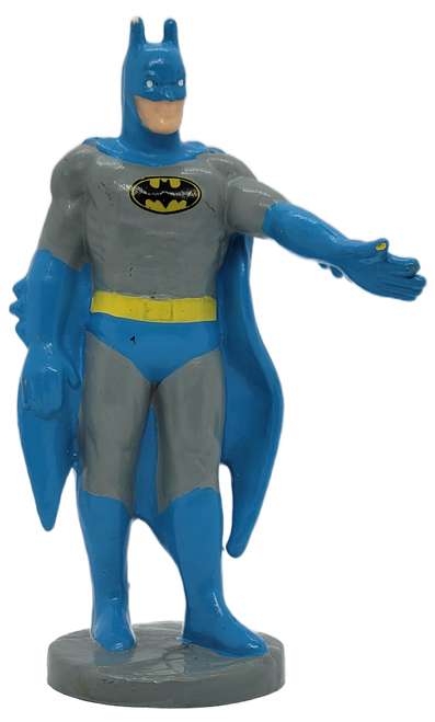 Applause 1988 DC Comics 3.5-inch tall figure of Batman. The PVC figure features Batman wearing his grey and blue suit with gold utility belt.  He is standing on a grey brick stand with both of his left arm raised and right arm to the side.
