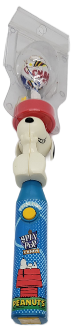 Spin-Pop 1999 candy holder featuring Snoopy and Woodstock from the Peanuts. Snoopy has his red food bowl on top of his head where Woodstock is sitting. The center of the food bowl has a lollipop standing vertical that spins to create a fun lollipop experience. The handle of the holder features Snoopy lying on top of his dog house with Peanuts under it with blue background.