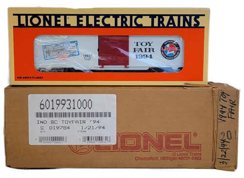 Lionel Electric Trains 6-19931 1994 Dealer New York Toy Fair Boxcar. The O gauge train car features "Toy Fair 1994" graphics, red doors, and a white body. It was a limited, uncatalogued item given exclusively to dealers.