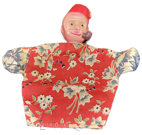 Vintage celluloid monkey wearing Fez hat and smoking a pipe small hand puppet that was Made in Japan. The monkey's head is 2-inches tall and 1.5-inches wide x 1.25-inches deep. The body is cloth with red background and white flowers. The body is 4.25-inches long and 7-inches wide.