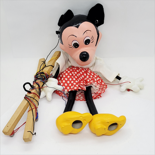 Vintage Pelham Puppets Walt Disney's Minnie Mouse hand made standard puppet for children. The Minnie Mouse marionette has a molded composition head with wooden limbs and a cross-shaped wooden control bar with strings. Pelham Puppets were Made in England.