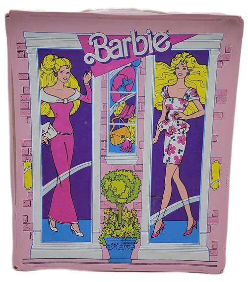 Mattel 1988 Barbie doll/wardrobe pink vinyl carrying case with storefront graphics. The case has hinged lid with turn closure and comes with cardboard dividers and hanging area to hold and separate outfits. The case is 12-inches tall by 10-inches wide and is 5-inches deep.