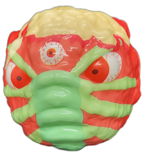 Mutant Monster Ball that is orange with blonde top. The mutant has a green scorpion across face with tail ending at back of the head, The ball has a 3-inch diameter and is made of foam.