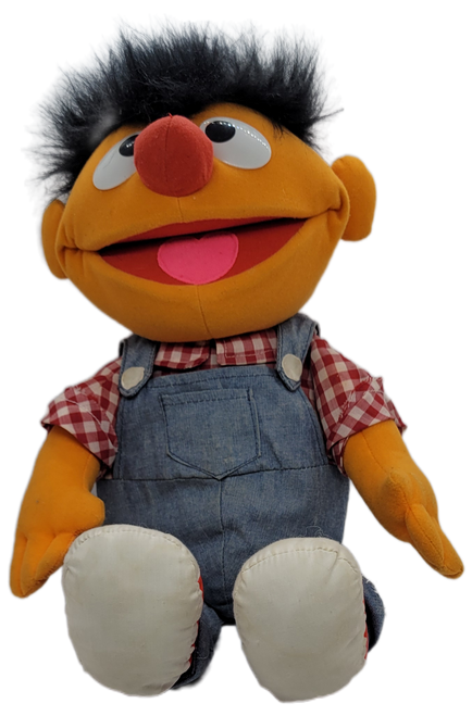 PLAYSKOOL 1995 On the Farm Ernie plush doll that sings "Old McDonald". Ernie is wearing jean bib overalls with red and white checkered shirt and red and white shoes. Ernie is 17-inches long and has battery pack in his back.