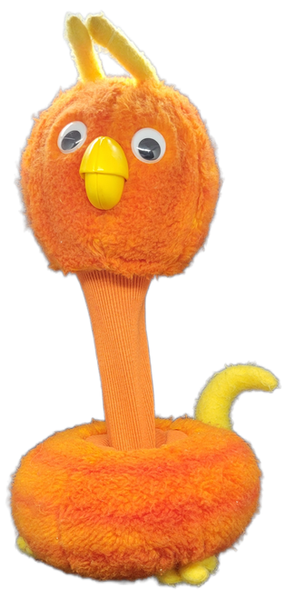 Worlds of Wonder 1985 Fay Fob orange bird plush hand puppet from Teddy Ruxpin. Fay, also known as Fay Fob, is the wife of Frank Fob. She appears in several episodes of the series, though most prominently in Uncle Grubby. She sits at 10-inches tall and extends up to 15-inches tall when neck is extended. Her base is 7-inches wide and 9-inches deep and was Made in China.