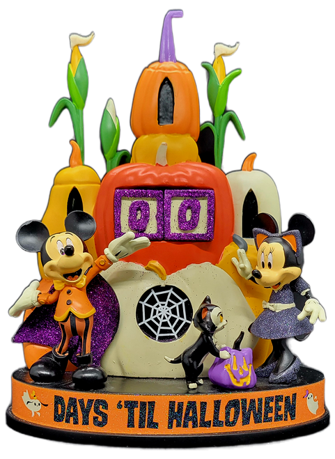 Disney Halloween countdown calendar featuring Mickey Mouse and Minnie Mouse. Mickey is dressed as a vampire and Minnie Mouse is dressed as a cat. The background and number holder is a collection of pumpkins in various size, shapes and colors with stalks of corn behind them. The number blocks are white with purple glitter edges and numbers. The calendar is 9-inches tall by 7-inches wide and 4-inches deep.