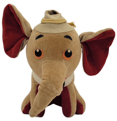 Vintage velveteen circus elephant plush toy Made in Japan. The saw dust filled elephant is brown with red underside and wearing a bow-tie and collar. The elephant is also wearing a hat that appears to have been cut near the base. The elephant sits at 5.5-inches tall by 5-inches wide by 4-inches deep.