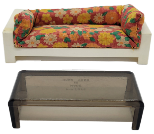 Fisher-Price doll house decorator set #256 Sofa and coffee table.  The set features a white sofa with reddish-orange with large yellow, orange and white flowers on it cushion and a smokey grey plastic coffee table. The cushion is part number FPT8112.