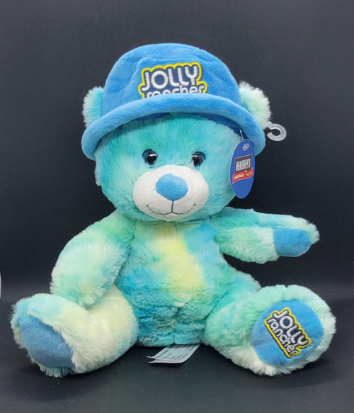 Hershey's Chocolate World Jolly Rancher blue tie-dye pattern teddy bear that is 10-inches tall. The bear is wearing a blue hat with Jolly Rancher on the front and his left foot has Jolly Rancher embroidered on it. The Hershey Company acquired the brand in 1996.