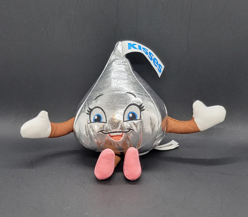 Hersheypark souvenir 5-inch tall Hershey's Kisses plush wearing pink shoes. The plush is for age 3 & up and Made in China. Hershey's Kisses are chocolates first produced by the Hershey Company in 1907. The bite-sized pieces of chocolate have a distinctive conical shape.