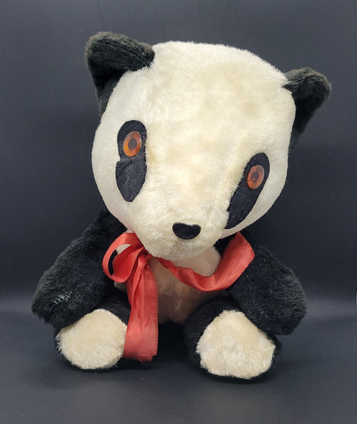 Vintage Panda aka Panda Bear stuffed animal by Dollcraft Novelty Co. The Panda is 11-inches tall and has plastic eyes and wearing a red ribbon. The white is off white color, may be by design or from age. The giant panda, also known as the panda bear or simply panda, is a bear species endemic to China.