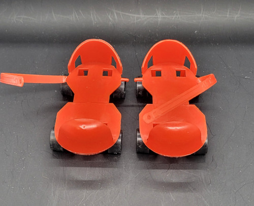 Mattel 1960's Baby First Step Dolls plastic red roller skates that slid over the feet of the doll. The skates are 4-inches long and a 3 3/4-inch inner footbed. The skates featured grooved bottoms to help stabilize her as she moved