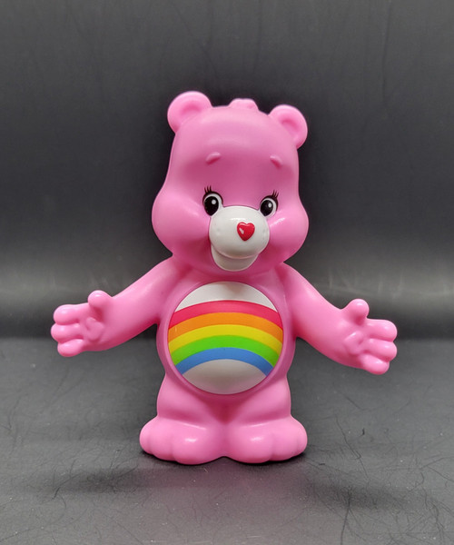 Burger King Kids' Club Cheer Bear from the 2017 Care Bears series of toys, Cheer Bear is pink with rainbow on belly and stands 4-inches tall. The series contained 3 different Care Bears and was available at the same time as Voltron: Legendary Defenders series of 3 toys. The toys were available at Burger King from April to May of 2017.