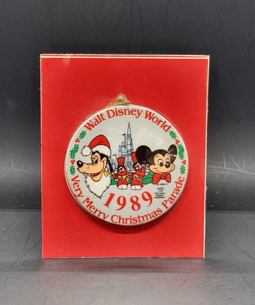Walt Disney World 1989 Very Merry Christmas Parade ornament with Mickey Mouse and Goofy. The ornament was made for Eastman Kodak Company and is 2 1/4" diameter.