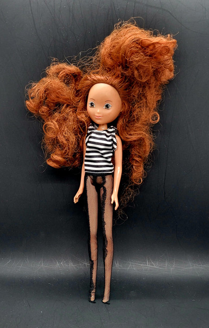 SmartZone doll from the 2018 Ebony line of dolls. The 10-inch doll comes in a standing position that would be wearing high heeled shoes. She comes with black and white striped shirts and fishnet stockings.