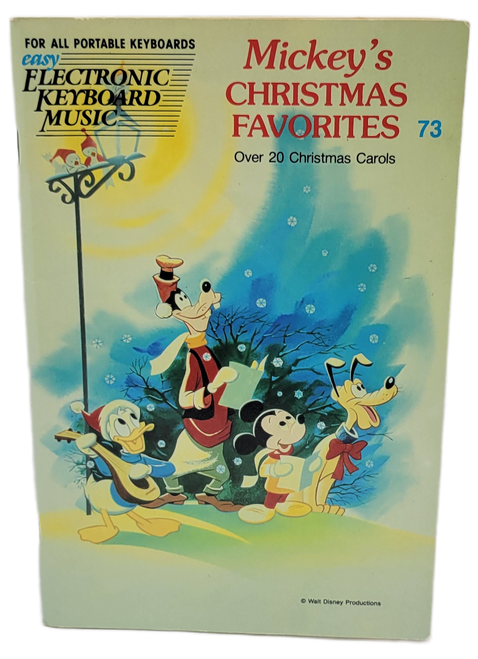 Disney Mickey's Christmas Favorites Christmas Carols keyboard instruction book by Hal Leonard Publishing Corporation. The book contains 23 Christmas Carols to play on electronic keyboard. The book was published in 1975.