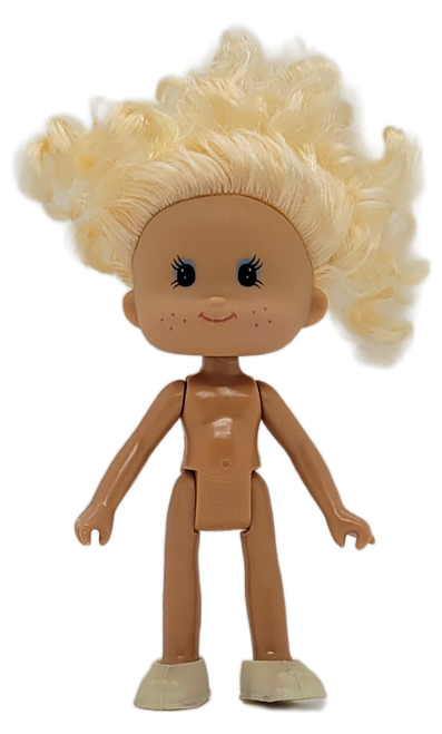 Vintage Greenbrier International doll toy figure with blonde hair. The figure stands 5-inches tall and resembles Strawberry Shortcake characters. The doll has blue eyes and freckles and was made in China.