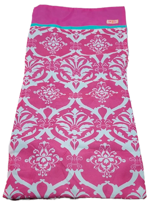 Our Generation pink and white damask pattern sleeping bag for 18-inch dolls. The bag would have come in sleepover or camping play sets. The sleeping bag is 19-inches long and 8-inches wide.