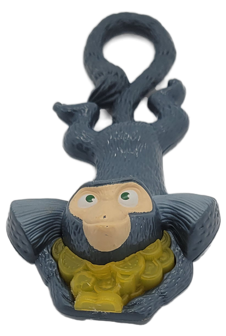 McDonald's Happy Meal toy of #8 Mauro the marmoset monkey from the 2011 Rio: The Movie series of toys. Mauro is depicted holding a stack of yellow plastic coins that light up when tail is pulled. The US series contains 8 different characters and was available April 8 - 28, 2011.