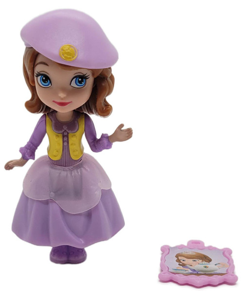Mattel Disney Sofia the First Buttercup Troop Sofia 3-Inch Figure #2 (Loose), loose Sofia figure wearing a purple beret, yellow vest, and lavender dress, shown with a pink character accessory on a white background.