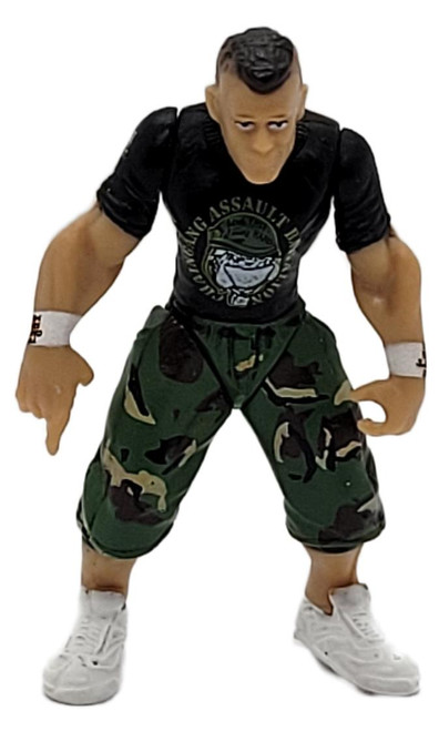 Jakks Pacific WWE Micro Aggression John Cena 2-Inch Action Figure (2006) - Collectible Toy for Ages 3+, small John Cena wrestling figure wearing a black T-shirt, green camouflage shorts, white wristbands, and white sneakers, shown standing against a white background.