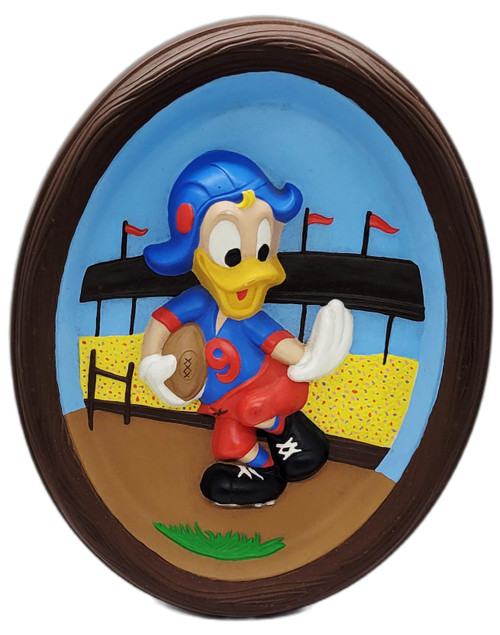 Walt Disney Productions Vintage Disney Donald Duck Playing Football 3D Plaster Wall Plaque Hand Painted, oval hand-painted relief showing Donald Duck in a blue helmet, red pants, and football uniform holding a football on a field