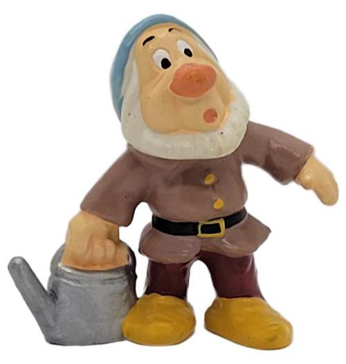 Maia & Borges Vintage 1980s M+B Disney Sneezy Dwarf PVC Figure – Snow White and the Seven Dwarfs – Portugal, Sneezy wearing a blue cap, brown tunic, and yellow shoes beside a gray watering can