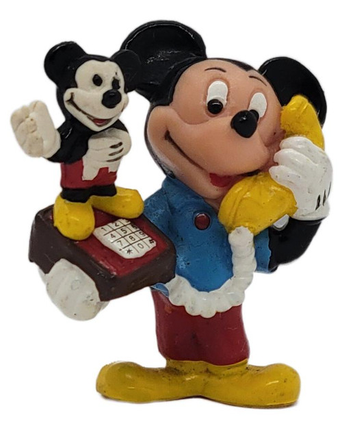 Applause Vintage 1980s Applause Mickey Mouse Telephone PVC Figurine – Made in Hong Kong, colorful figurine of Mickey Mouse holding a yellow telephone handset, with a miniature Mickey Mouse figure standing on the phone base